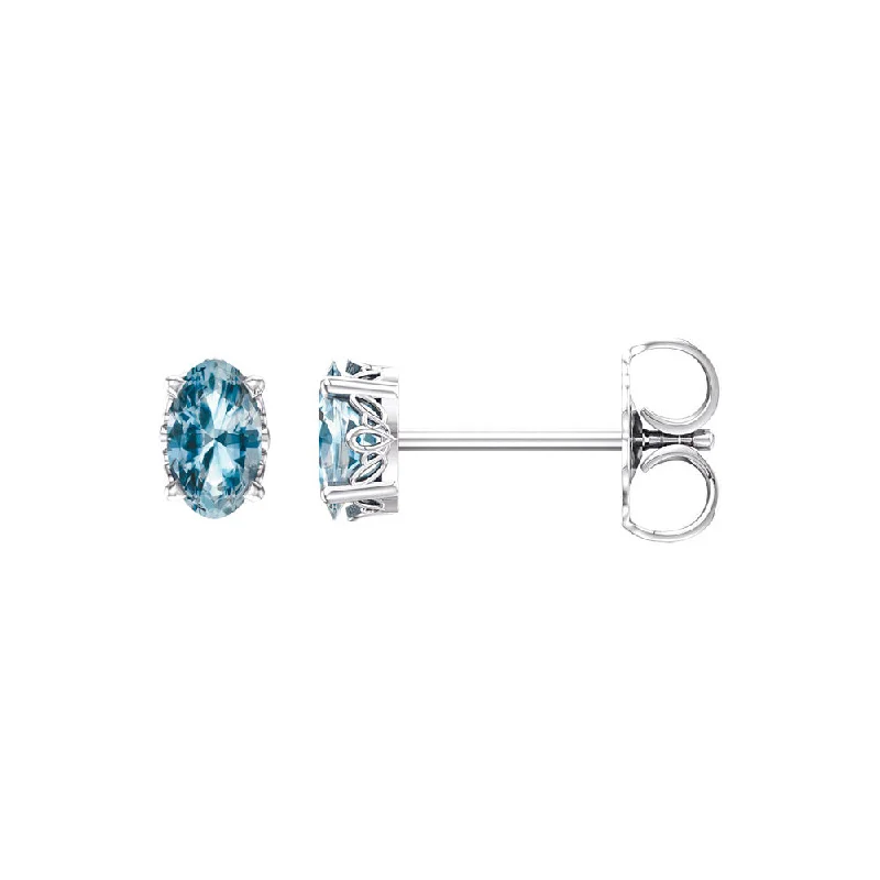 Ladies earrings matching pairs-Faceted Oval Sky Blue Topaz Stud Earrings in 14k White Gold